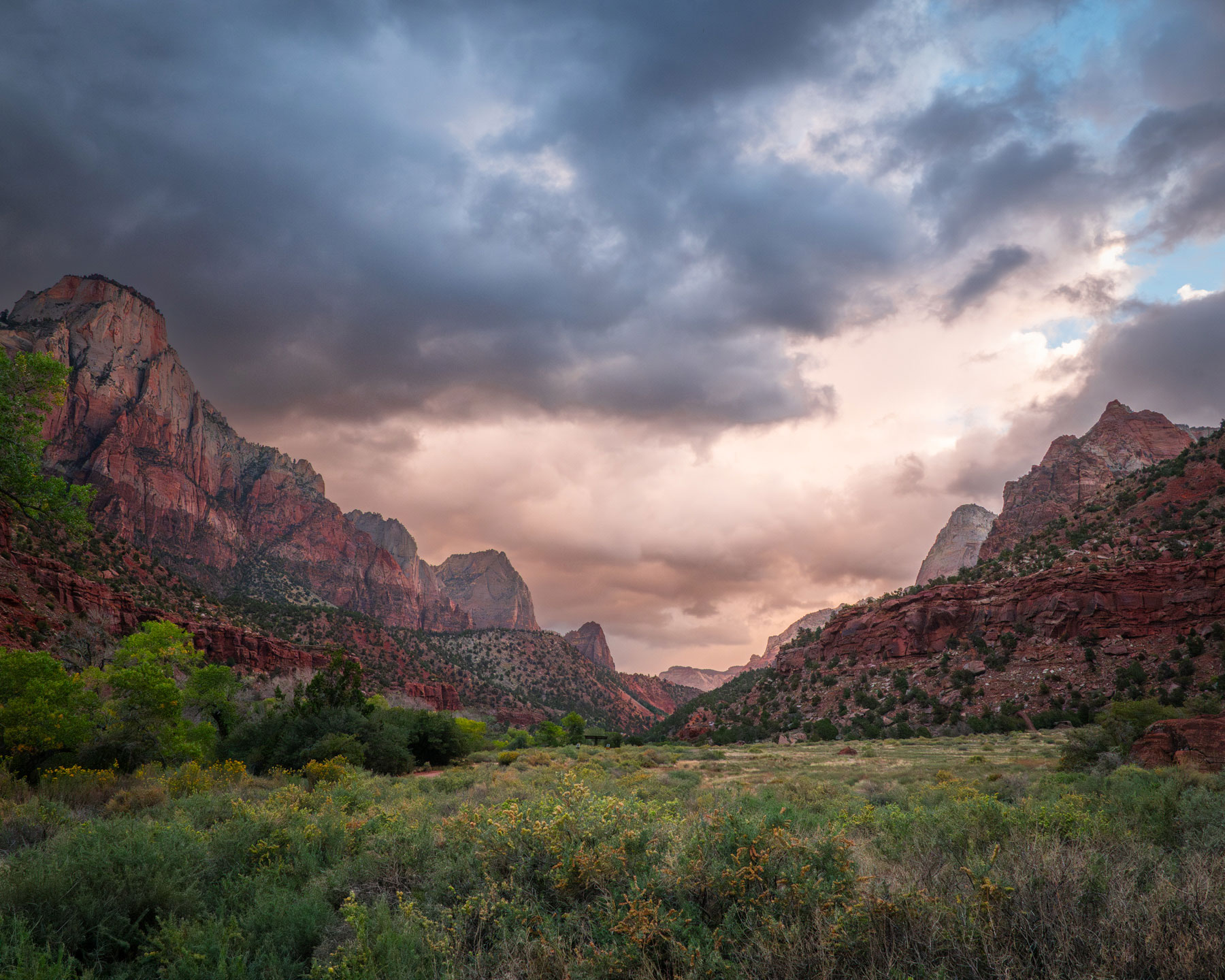 zion-national-park-watchman-sunrise-landscape-photography Fine art landscape photograph of The Watchman mountain in Zion National Park at sunset, with the Virgin River flowing in the foreground and golden light hitting the red sandstone cliffs.